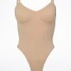 Bloch Seamless Thong Bodysuit -Dance Costume Store bl l3147nud bloch seamless thong bodysuit tan front 96465.1678925951